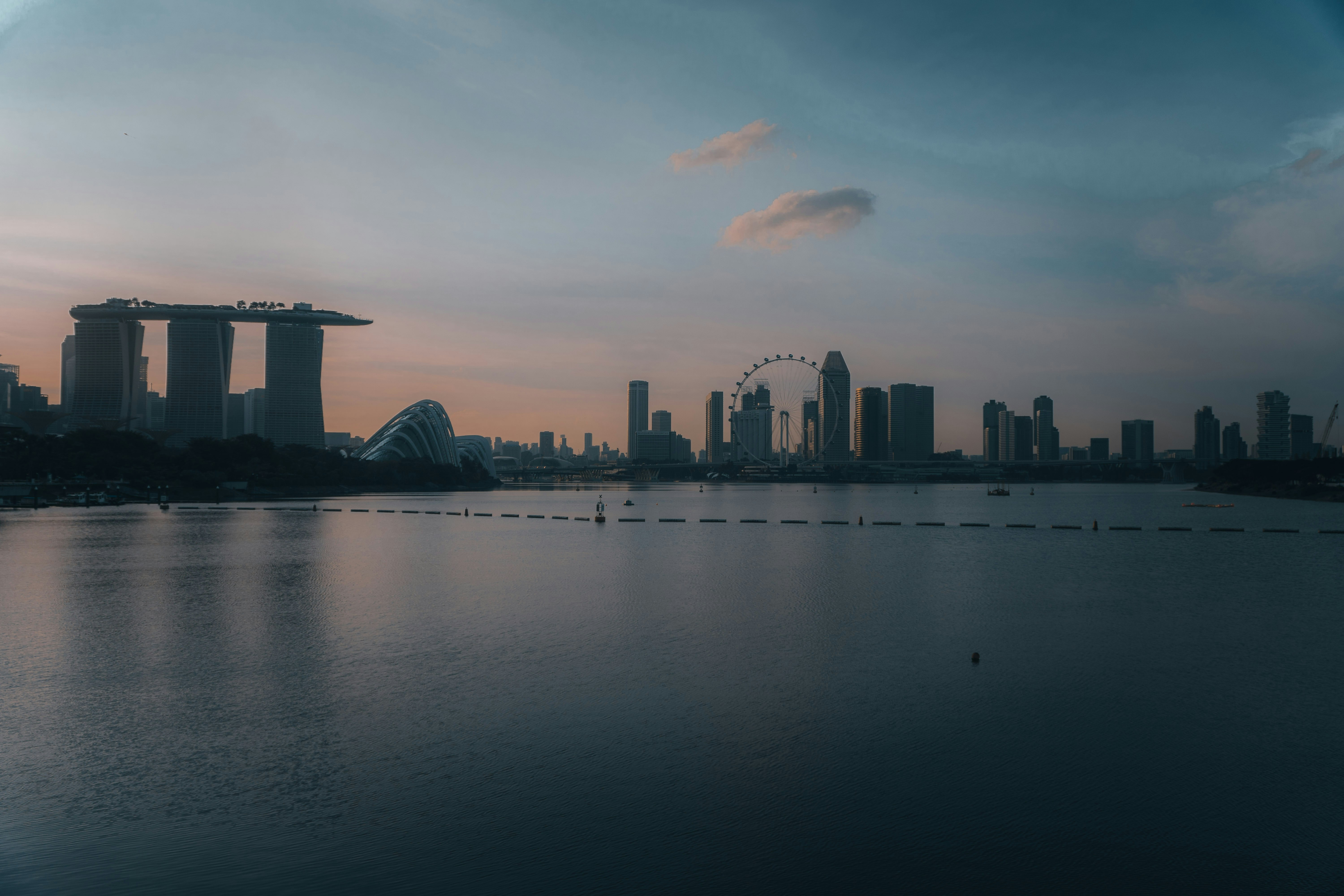 city skyline across body of water during daytime